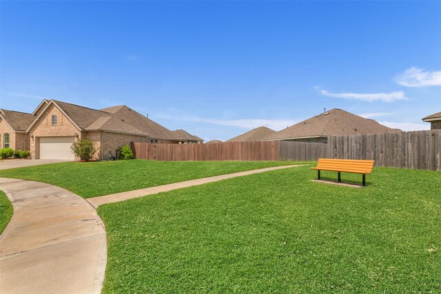 505 Ozark Ct, League City, TX 77573 - view of yard with concrete driveway and an attached garage