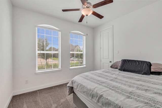 505 Ozark Ct, League City, TX 77573 - carpeted bedroom featuring baseboards and ceiling fan