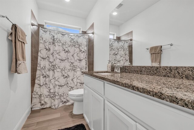 505 Ozark Ct, League City, TX 77573 - bathroom with vanity, plenty of natural light, and wood finished floors
