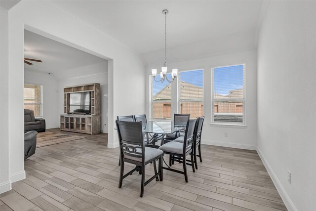505 Ozark Ct, League City, TX 77573 - dining space with a chandelier, light wood-style floors, and ceiling fan