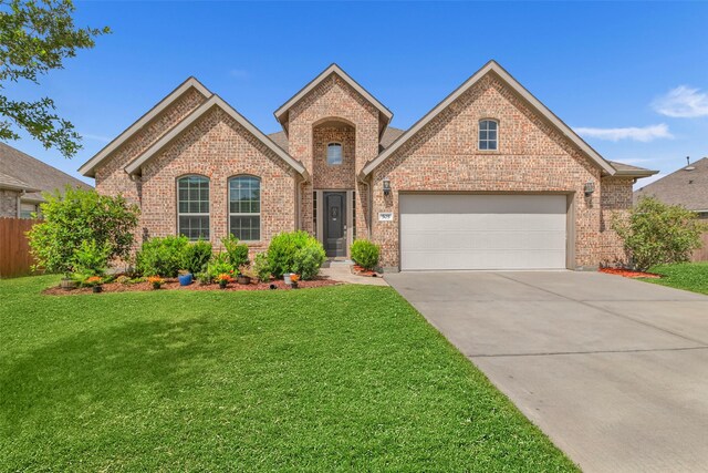 505 Ozark Ct, League City, TX 77573 - traditional-style house with brick siding, concrete driveway, and an attached garage