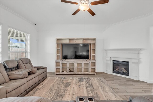505 Ozark Ct, League City, TX 77573 - living area with ceiling fan, ornamental molding, wood finished floors, and a glass covered fireplace