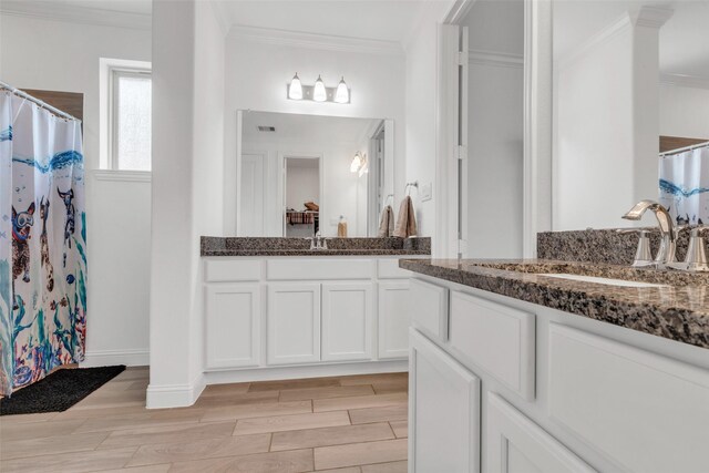 505 Ozark Ct, League City, TX 77573 - full bath featuring ornamental molding, vanity, wood finished floors, and a shower with shower curtain
