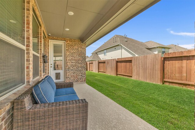 505 Ozark Ct, League City, TX 77573 - fenced backyard featuring a patio area and an outdoor living space