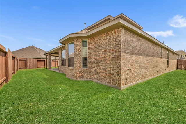 505 Ozark Ct, League City, TX 77573 - back of property with brick siding and a fenced backyard