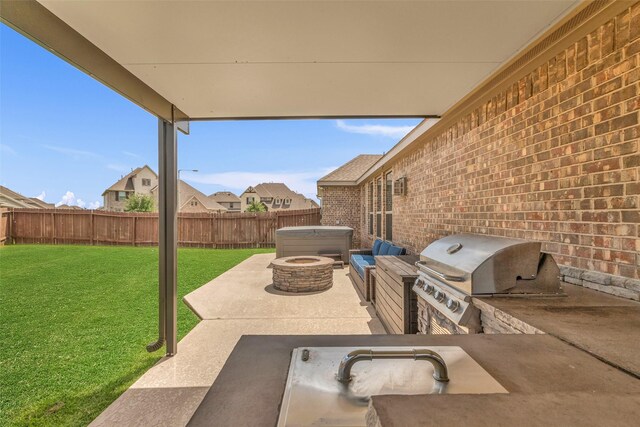 505 Ozark Ct, League City, TX 77573 - fenced backyard with a patio, exterior kitchen, and a hot tub