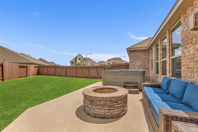 505 Ozark Ct, League City, TX 77573 - fenced backyard with a hot tub, a patio, and an outdoor living space with a fire pit