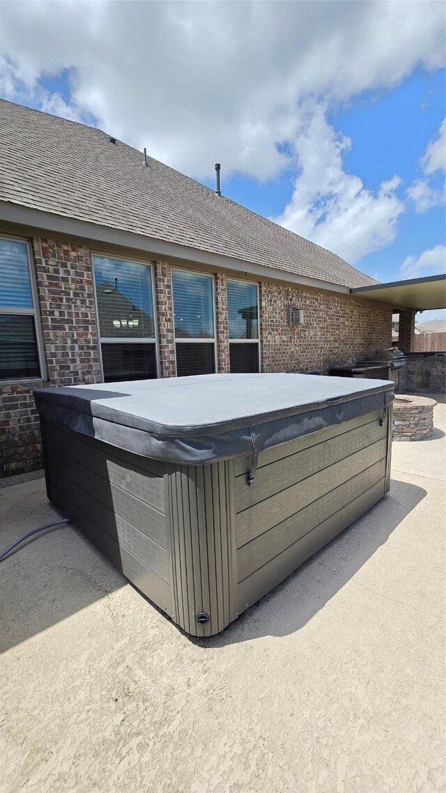 505 Ozark Ct, League City, TX 77573 - view of patio / terrace with a hot tub