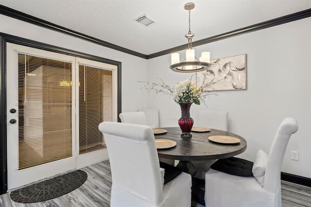 208 Moss Hill Ln, Conroe, TX 77303 - dining room with crown molding and baseboards