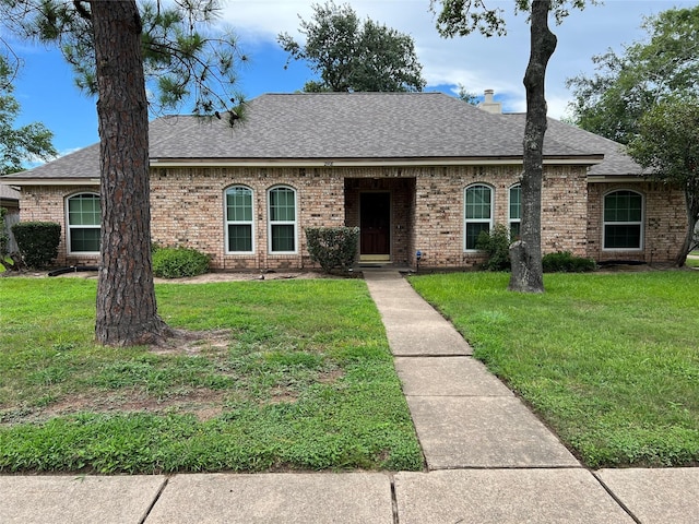 2908 Sugar Wood Dr, League City, TX 77573 - view of front of property with a shingled roof, brick siding, and a front yard