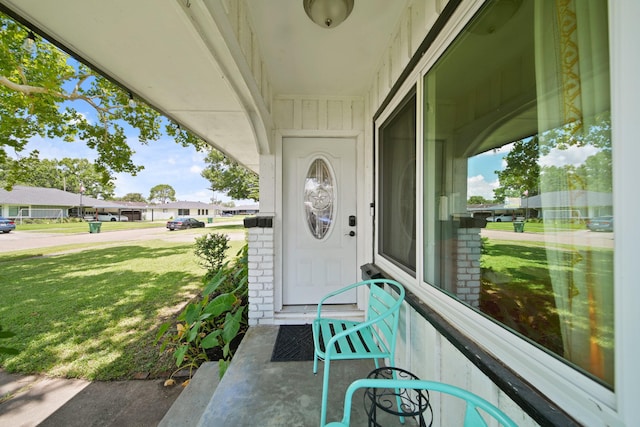 5411 Meadow Creek Ln, Houston, TX 77017 - doorway to property with a lawn, brick siding, and a residential view