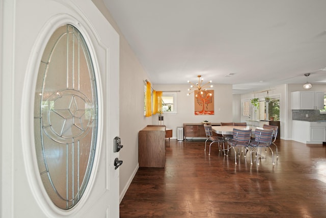 5411 Meadow Creek Ln, Houston, TX 77017 - dining area featuring a chandelier, dark wood-style floors, and plenty of natural light