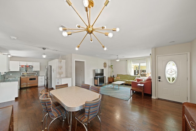 5411 Meadow Creek Ln, Houston, TX 77017 - dining room with a chandelier and dark wood-style flooring