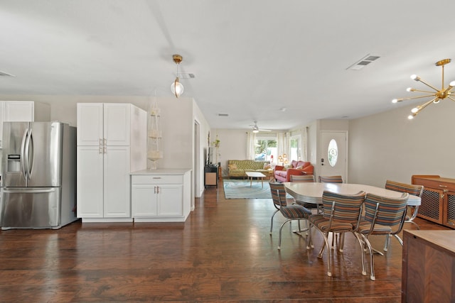 5411 Meadow Creek Ln, Houston, TX 77017 - dining room featuring dark wood-style floors and a chandelier
