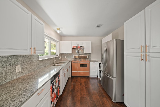 5411 Meadow Creek Ln, Houston, TX 77017 - kitchen featuring stainless steel fridge with ice dispenser, range with electric stovetop, dishwasher, under cabinet range hood, and dark wood finished floors