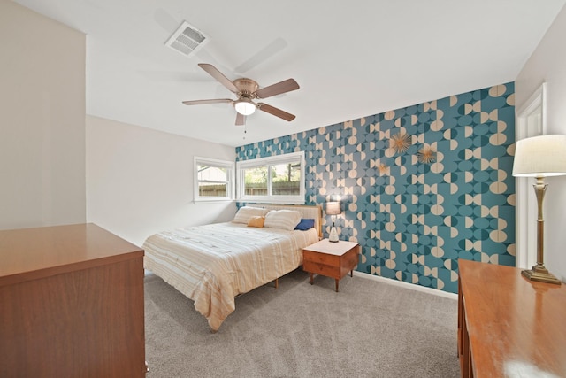 5411 Meadow Creek Ln, Houston, TX 77017 - bedroom with wallpapered walls, carpet floors, and ceiling fan