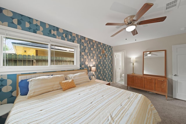 5411 Meadow Creek Ln, Houston, TX 77017 - carpeted bedroom with wallpapered walls and ceiling fan