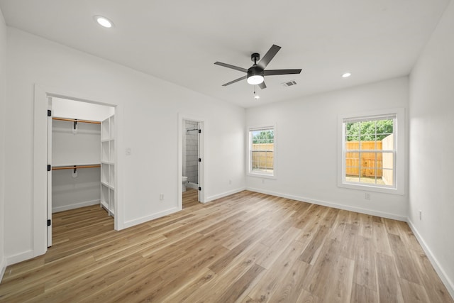 6206 Lyndhurst Dr, Houston, TX 77087 - unfurnished bedroom featuring light wood-style floors, a spacious closet, recessed lighting, connected bathroom, and a closet