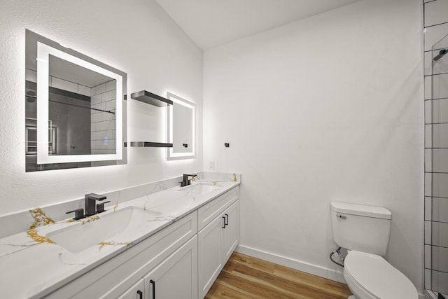 6206 Lyndhurst Dr, Houston, TX 77087 - full bathroom with wood finished floors, double vanity, and a shower