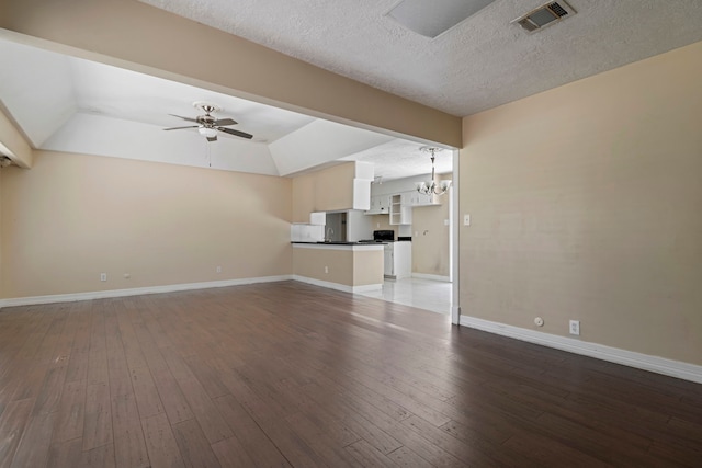 8631 Alcott Dr, Houston, TX 77080 - unfurnished living room with wood-type flooring, ceiling fan, a chandelier, a textured ceiling, and lofted ceiling