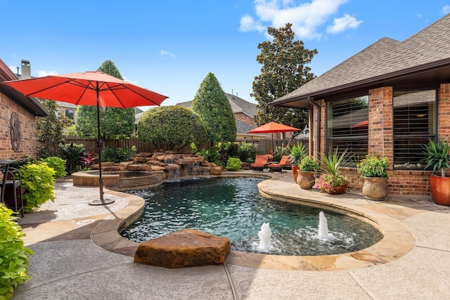 12218 Johns Enterprise Ct, Cypress, TX 77433 - view of swimming pool with a fenced backyard, a pool with connected hot tub, and a patio area