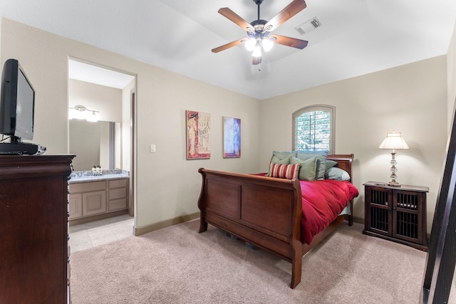 12218 Johns Enterprise Ct, Cypress, TX 77433 - bedroom with light carpet, ensuite bath, a ceiling fan, and light tile patterned floors