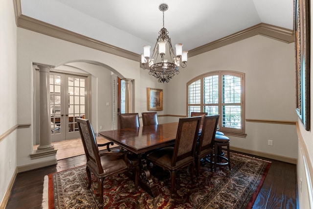 12218 Johns Enterprise Ct, Cypress, TX 77433 - dining area featuring arched walkways, a chandelier, lofted ceiling, wood finished floors, and crown molding