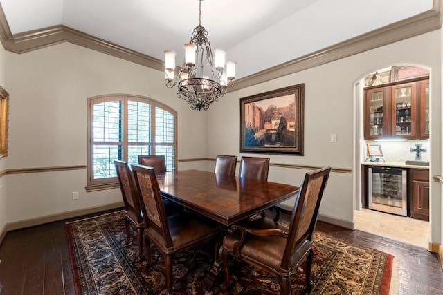 12218 Johns Enterprise Ct, Cypress, TX 77433 - dining area featuring wine cooler, a chandelier, a bar, vaulted ceiling, and hardwood / wood-style flooring