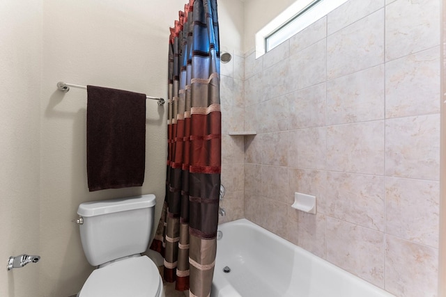 12218 Johns Enterprise Ct, Cypress, TX 77433 - bathroom featuring shower / bath combo with shower curtain and toilet