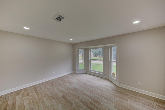 8822 Rowan Ln, Houston, TX 77036 - empty room with recessed lighting and light wood finished floors