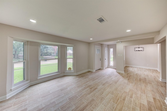 8822 Rowan Ln, Houston, TX 77036 - entryway featuring light wood-style floors, healthy amount of natural light, recessed lighting, and a chandelier