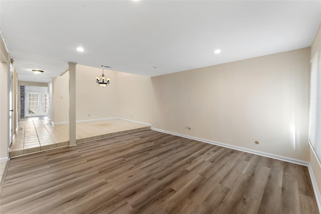 11614 Village Place Dr Unit 337, Houston, TX 77077 - unfurnished room featuring a chandelier, wood finished floors, recessed lighting, and healthy amount of natural light