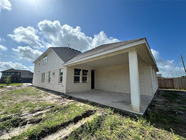 902 Hooks Trl, League City, TX 77573 - rear view of property featuring brick siding and a patio area