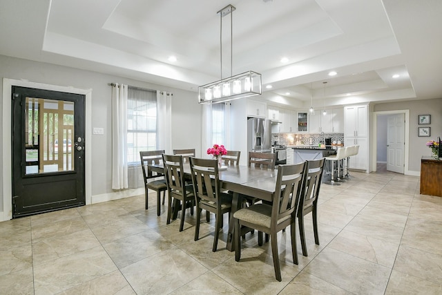 910 11th St, South Houston, TX 77587 - dining area featuring a tray ceiling and recessed lighting