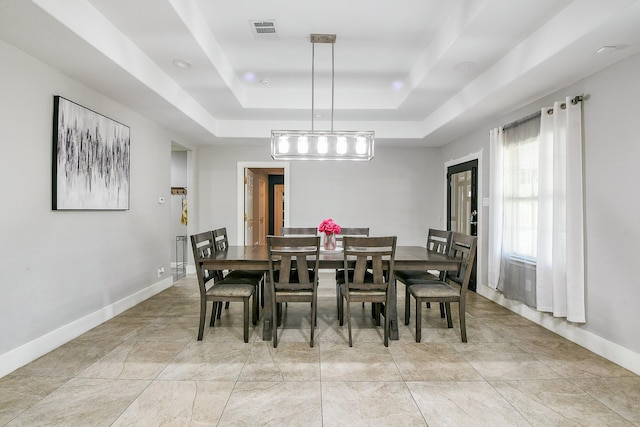 910 11th St, South Houston, TX 77587 - dining area featuring a raised ceiling and baseboards