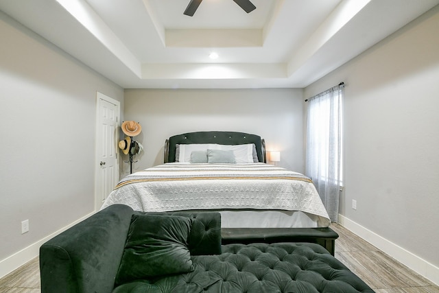 910 11th St, South Houston, TX 77587 - bedroom with a raised ceiling, ceiling fan, wood finished floors, and recessed lighting