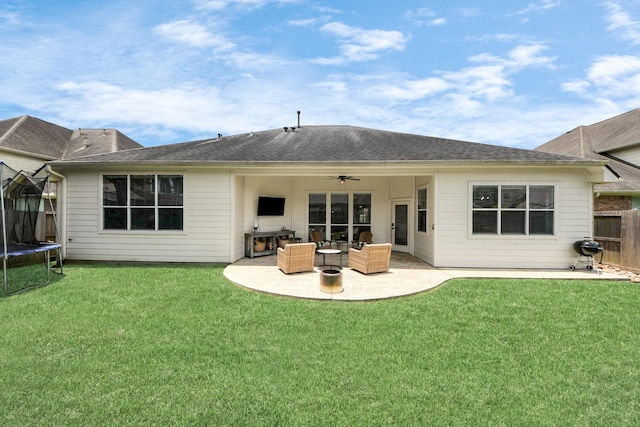 3214 Oak Park Ln, Missouri City, TX 77459 - back of house with a trampoline, a patio area, a ceiling fan, an outdoor hangout area, and roof with shingles