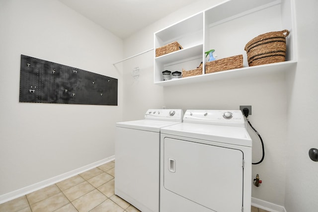 3214 Oak Park Ln, Missouri City, TX 77459 - laundry room featuring independent washer and dryer and light tile patterned floors