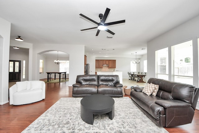 3214 Oak Park Ln, Missouri City, TX 77459 - living room with a chandelier, dark wood-style flooring, arched walkways, a ceiling fan, and recessed lighting