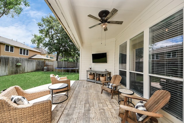 3214 Oak Park Ln, Missouri City, TX 77459 - wooden terrace with a trampoline, a fenced backyard, and a ceiling fan