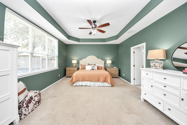 3214 Oak Park Ln, Missouri City, TX 77459 - bedroom with light carpet, a raised ceiling, and ceiling fan