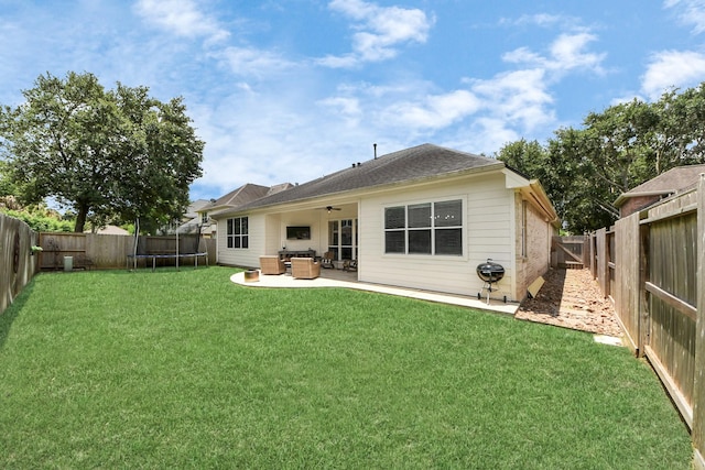 3214 Oak Park Ln, Missouri City, TX 77459 - back of property with a trampoline, a ceiling fan, a fenced backyard, a patio, and outdoor lounge area