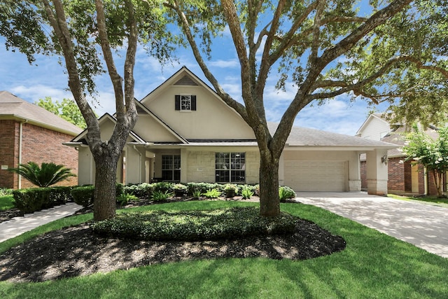 3214 Oak Park Ln, Missouri City, TX 77459 - traditional home featuring an attached garage, stucco siding, and driveway