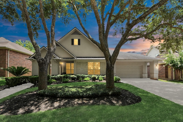 3214 Oak Park Ln, Missouri City, TX 77459 - traditional home featuring an attached garage, concrete driveway, stucco siding, and brick siding