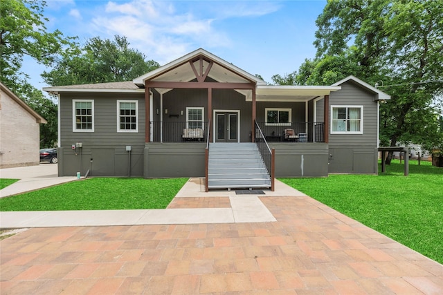 1415 Pony Ln, Simonton, TX 77485 - view of front facade featuring a front lawn, stairs, crawl space, and covered porch