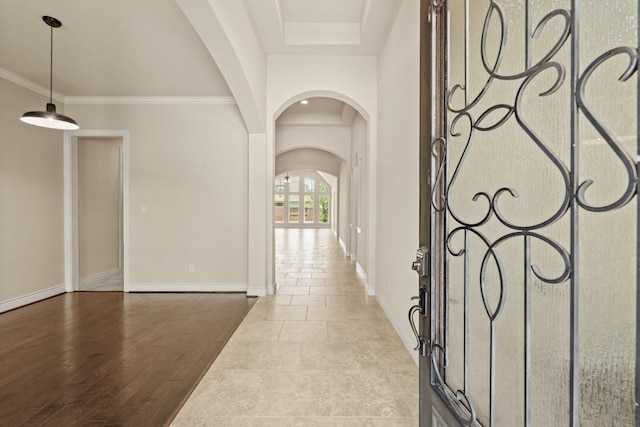 1719 Quail Ridge Dr, Katy, TX 77493 - entrance foyer featuring arched walkways, a raised ceiling, and ornamental molding