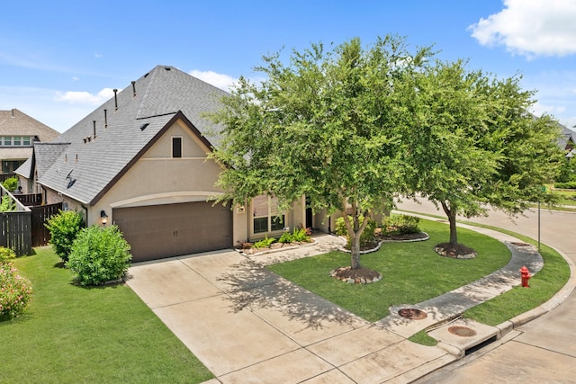 1719 Quail Ridge Dr, Katy, TX 77493 - view of front of property featuring concrete driveway, a garage, a front yard, stucco siding, and a shingled roof