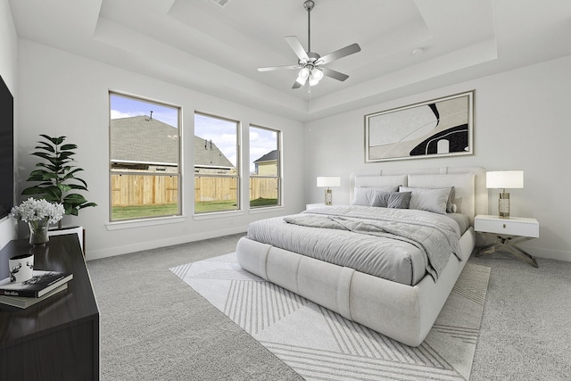 2806 Nova Beach Dr, Texas City, TX 77568 - carpeted bedroom featuring a tray ceiling and ceiling fan