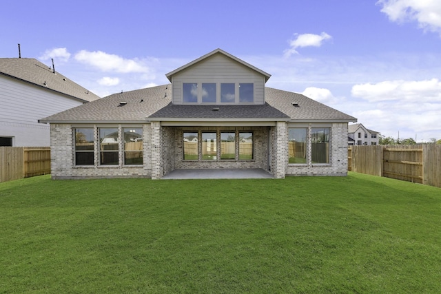 2806 Nova Beach Dr, Texas City, TX 77568 - rear view of property featuring a fenced backyard, a patio area, brick siding, and a shingled roof