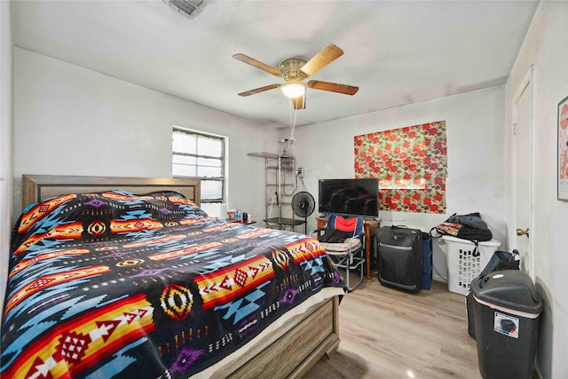 10926 Ivyridge Rd, Houston, TX 77043 - bedroom with wood finished floors and a ceiling fan